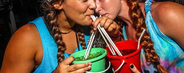 Drinking buckets at full moon party